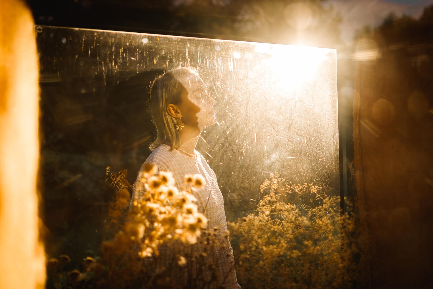 Profile of a person bathed in golden sunlight, representing hope and enjoyment of life, from Celin May's Sun Collection.