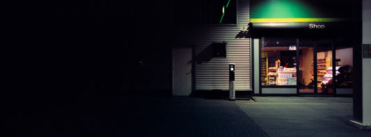The artwork 'Exterior #4' by Jildo Tim Hof showcasing high contrast scene going from complete darkness to light at a gas station