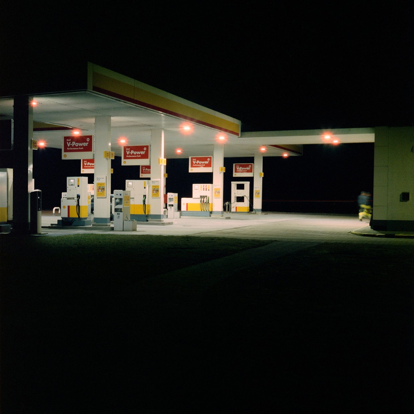 The artwork 'Exterior #5' by Jildo Tim Hof displaying a quiet gas station at night with as seen from the outside