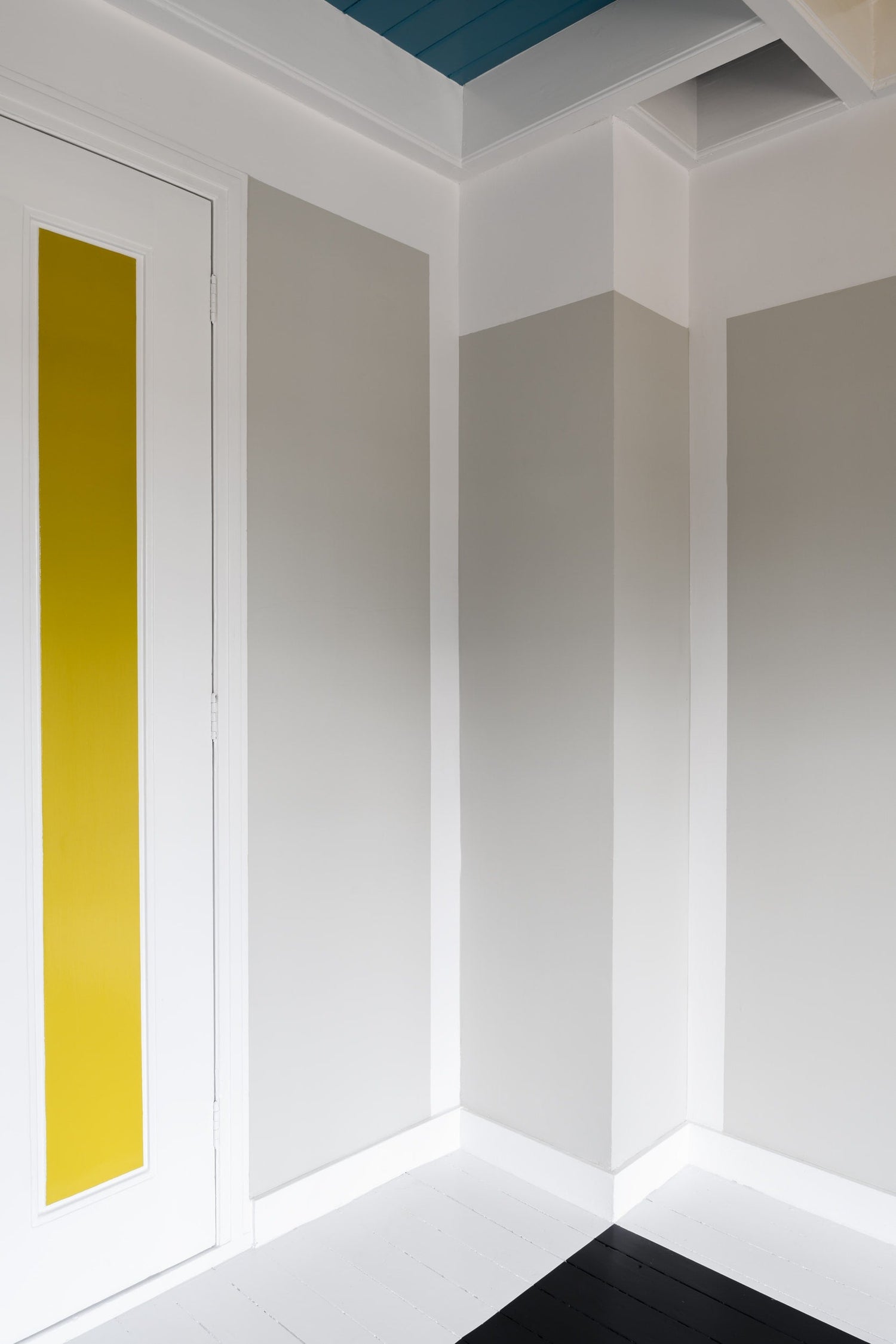 The artwork 'Van Doesburg-Rinsemahuis #7' by J.T. Hof displaying a grey wall and right half of a white door with a yellow stripe