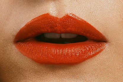 The artpiece 'Lips' by Rebekka Eliza shows the lips of a person wearing red lipstick in a close up view. Mouth slightly opened.